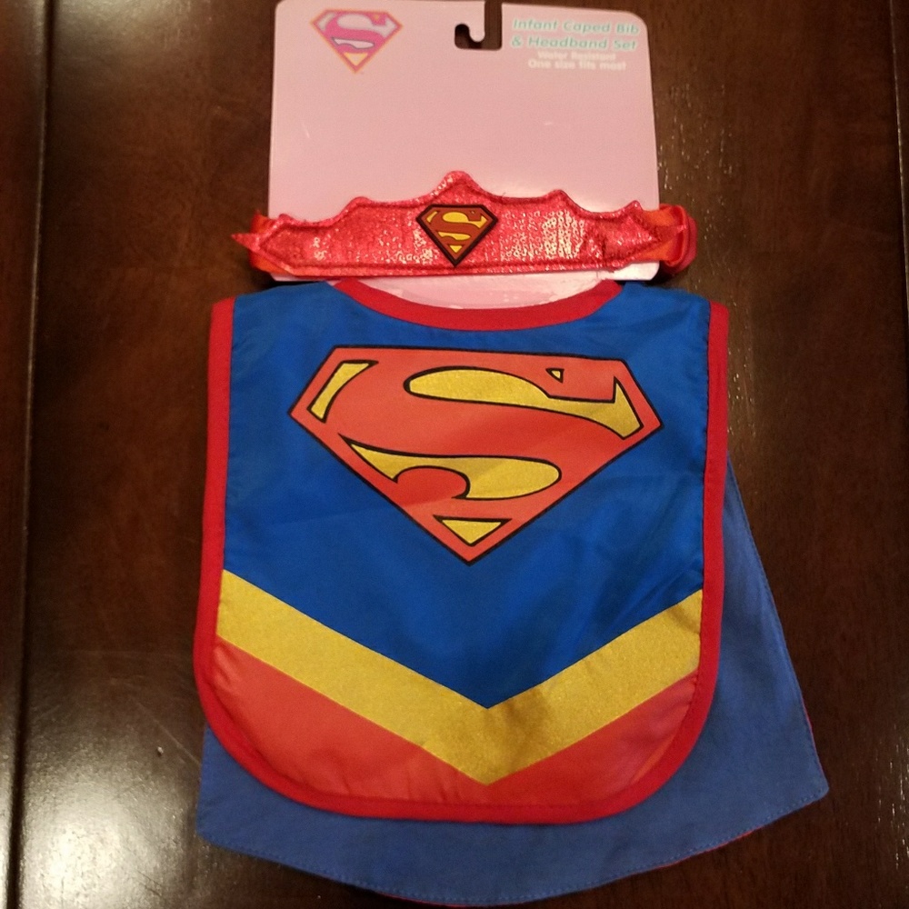 NWT.  Supergirl Infant Caped Bib & Headband Set